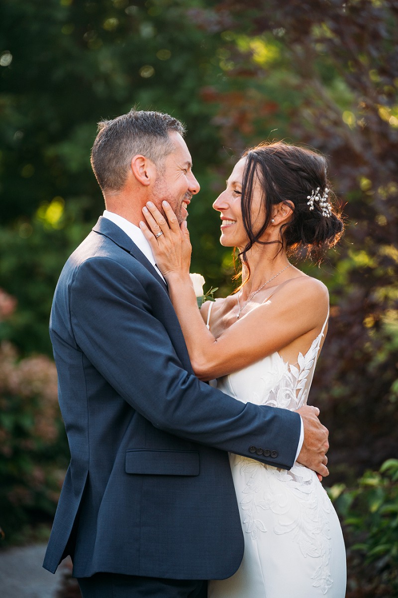 bride and groom smiling at each other